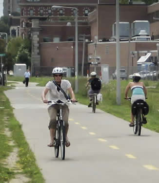 Bicyclist riding on downtown path